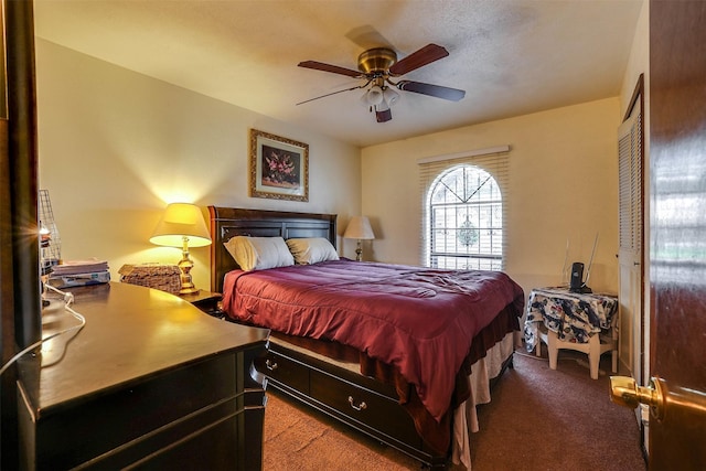 bedroom featuring a closet, ceiling fan, and carpet floors