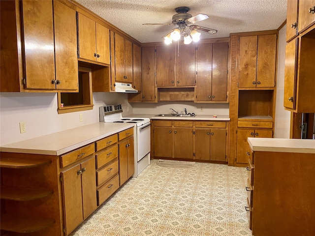 kitchen featuring light tile patterned floors, a textured ceiling, white electric range oven, and ceiling fan