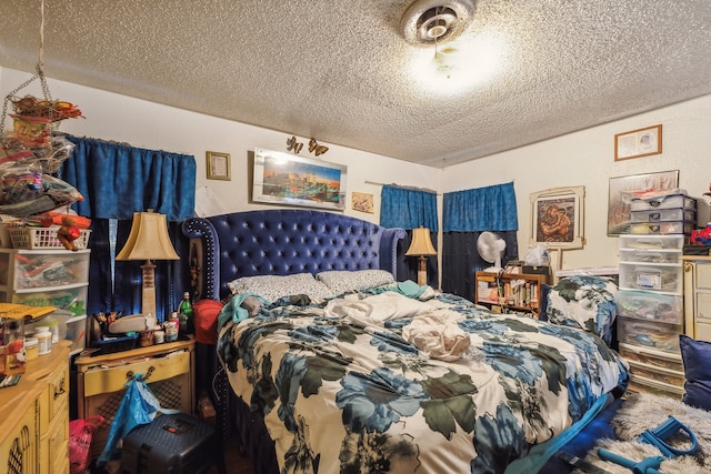 bedroom featuring a textured ceiling