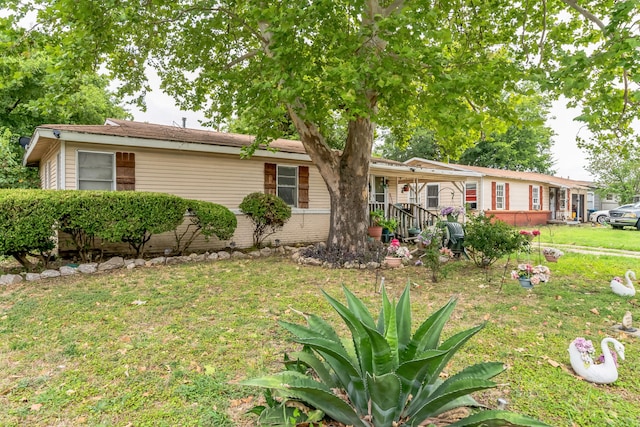 ranch-style home with a front lawn