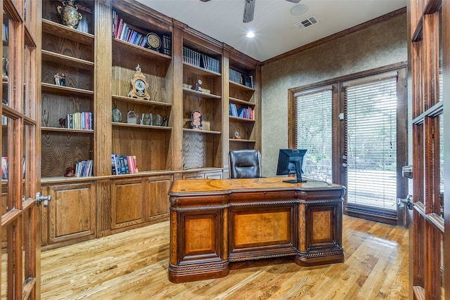 office with ceiling fan, light hardwood / wood-style floors, french doors, and ornamental molding