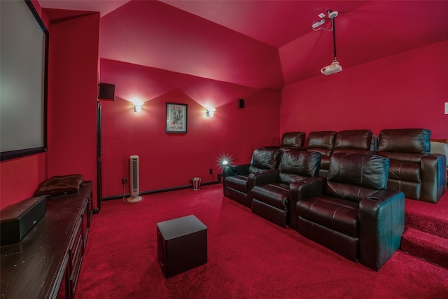 carpeted home theater featuring lofted ceiling