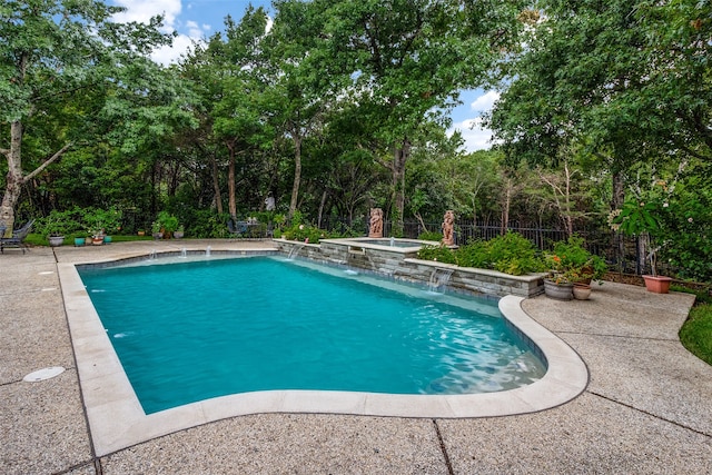 view of swimming pool with pool water feature