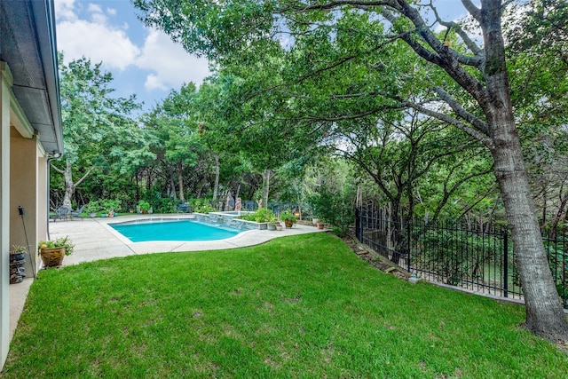 view of swimming pool with a lawn and a patio area