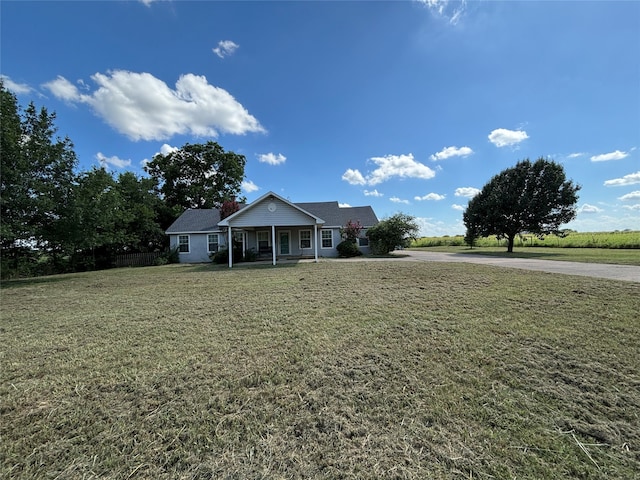 view of front of house with a front lawn and a porch