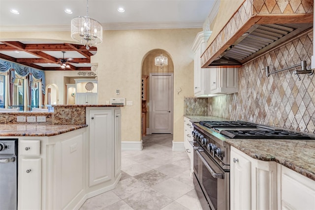 kitchen with white cabinetry, stainless steel stove, ceiling fan with notable chandelier, backsplash, and custom exhaust hood