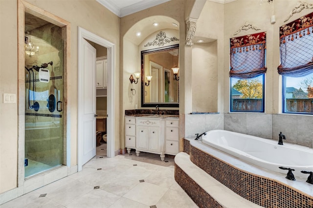 bathroom featuring tile patterned floors, vanity, separate shower and tub, and crown molding