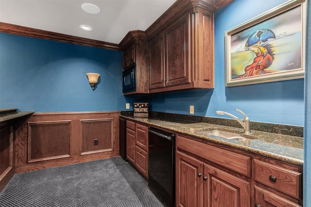 kitchen featuring dark stone counters, black appliances, and sink