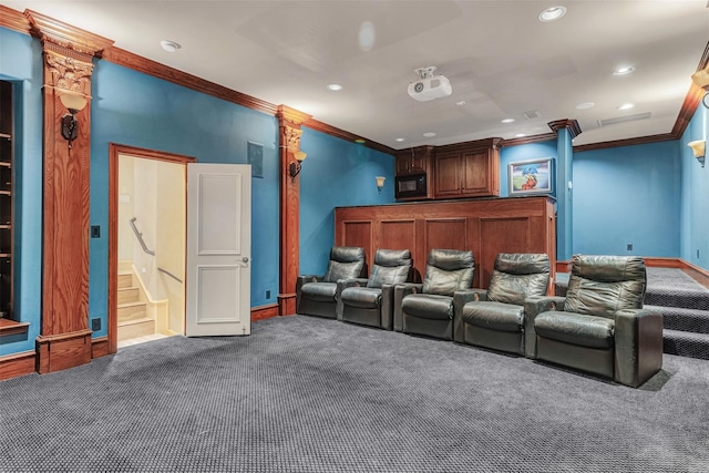 carpeted cinema featuring crown molding