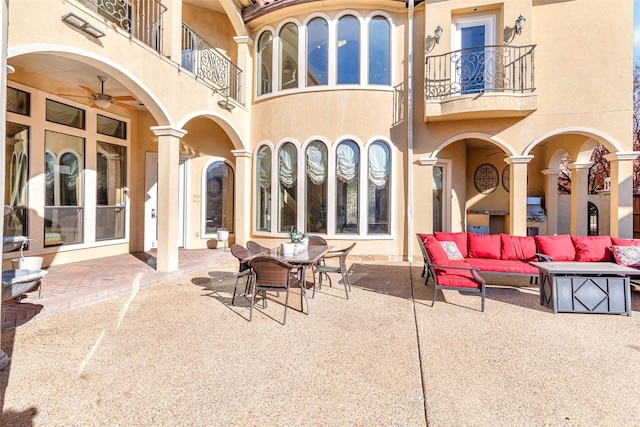 exterior space featuring a balcony and an outdoor hangout area