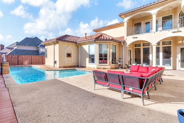 view of pool with outdoor lounge area and a patio area