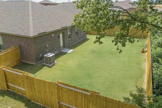 view of yard with central AC unit