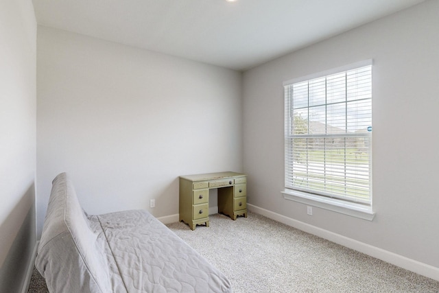 bedroom with light colored carpet