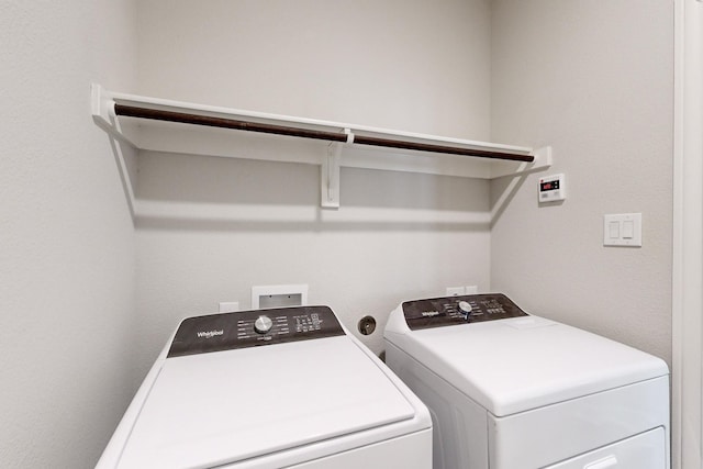 washroom featuring washer and dryer