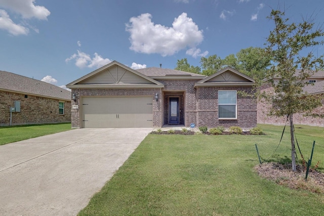 view of front of house with a garage and a front yard