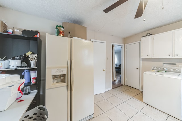 kitchen with light tile patterned floors, washer / clothes dryer, white cabinetry, ceiling fan, and white fridge with ice dispenser