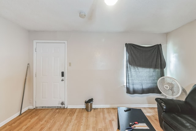 workout room with hardwood / wood-style flooring