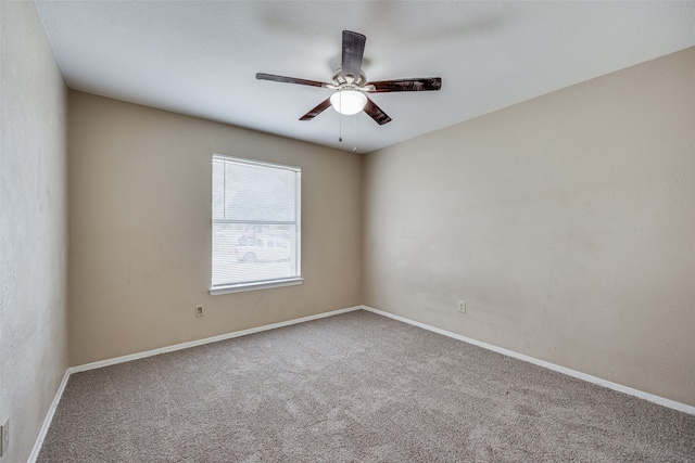 carpeted empty room with ceiling fan