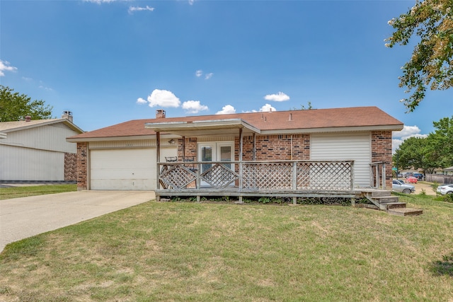 view of front of home featuring a garage and a front yard