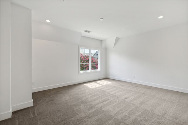 empty room featuring recessed lighting, baseboards, visible vents, and carpet floors