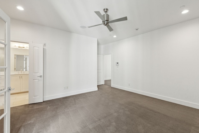 unfurnished room featuring carpet floors and ceiling fan