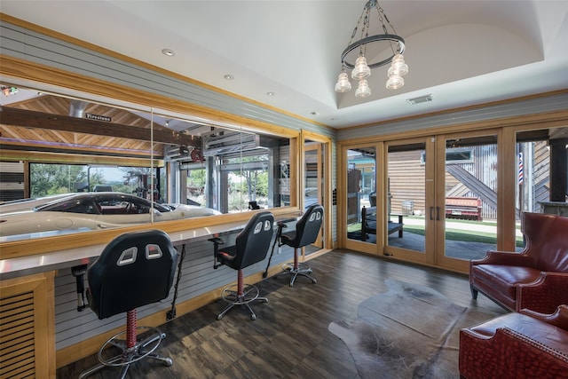 home office featuring lofted ceiling, dark hardwood / wood-style floors, and french doors