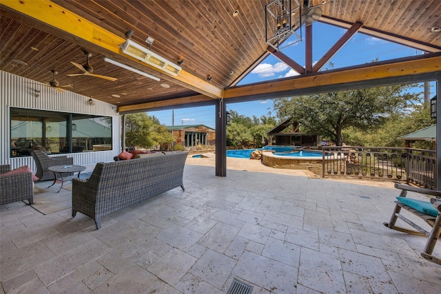 view of patio with a gazebo, an outdoor hangout area, ceiling fan, and a swimming pool with hot tub