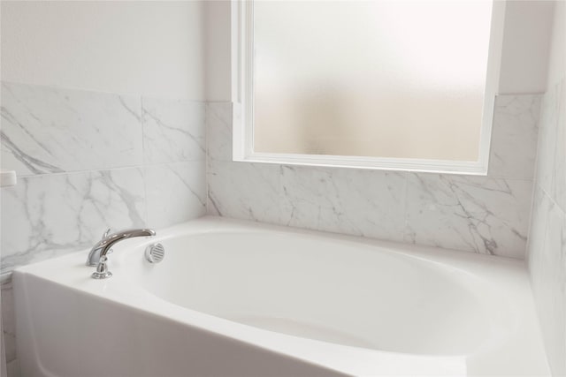 bathroom with a tub