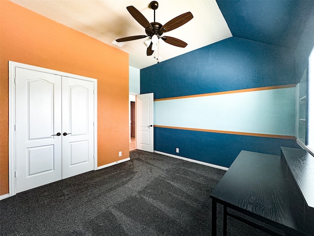 interior space with carpet flooring, lofted ceiling, ceiling fan, and a closet