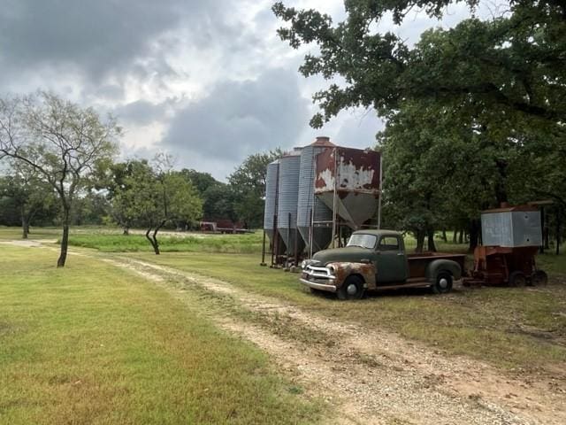 view of property's community with a yard