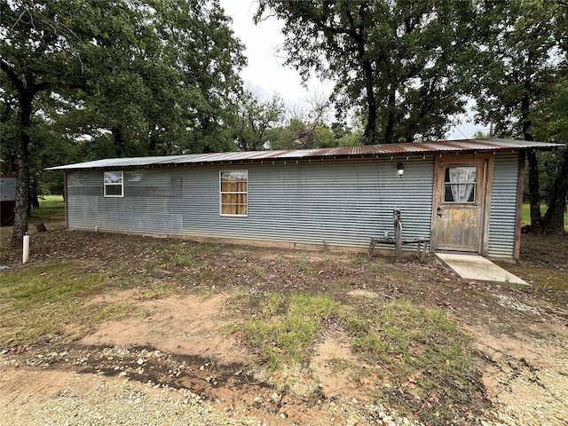 exterior space featuring metal roof