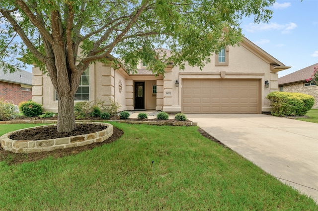 view of front facade featuring a garage and a front lawn