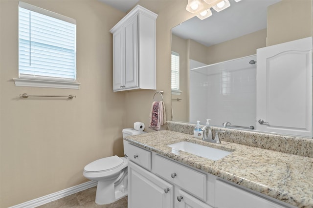 bathroom with walk in shower, vanity, toilet, and tile patterned flooring