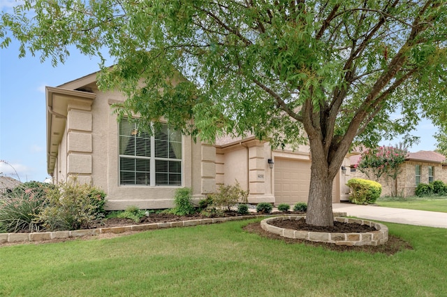 view of front of home with a garage and a front yard