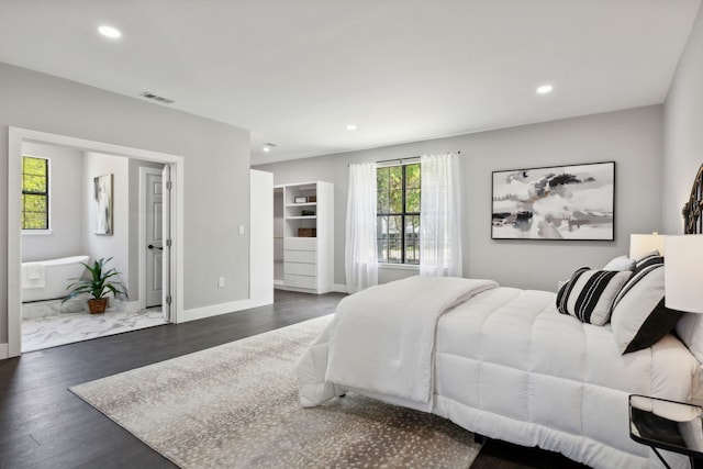 bedroom featuring baseboards, visible vents, dark wood-style flooring, and recessed lighting