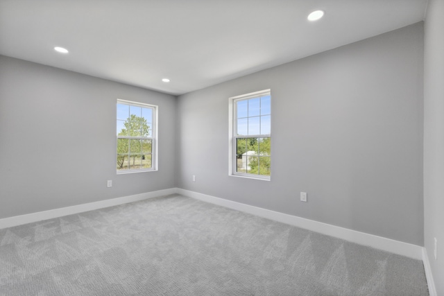 unfurnished room with recessed lighting, carpet flooring, and baseboards