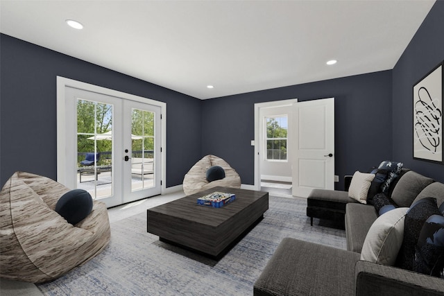 living room featuring recessed lighting, plenty of natural light, baseboards, and french doors