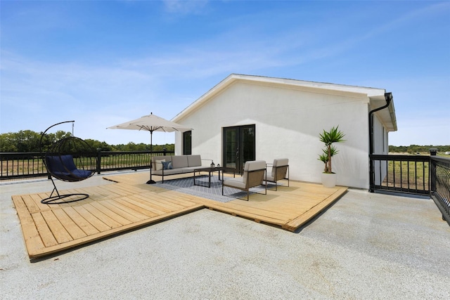 view of patio / terrace featuring a wooden deck and an outdoor hangout area