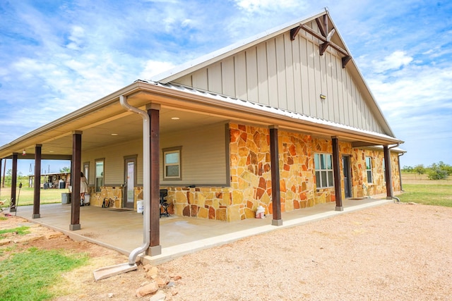 rear view of property featuring a patio