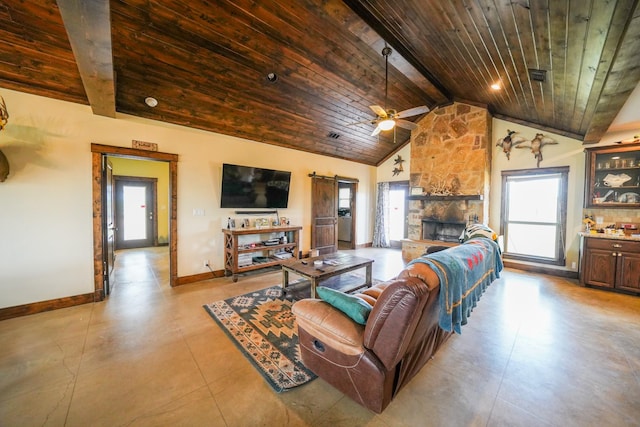 living room featuring a stone fireplace, lofted ceiling with beams, wooden ceiling, ceiling fan, and a barn door