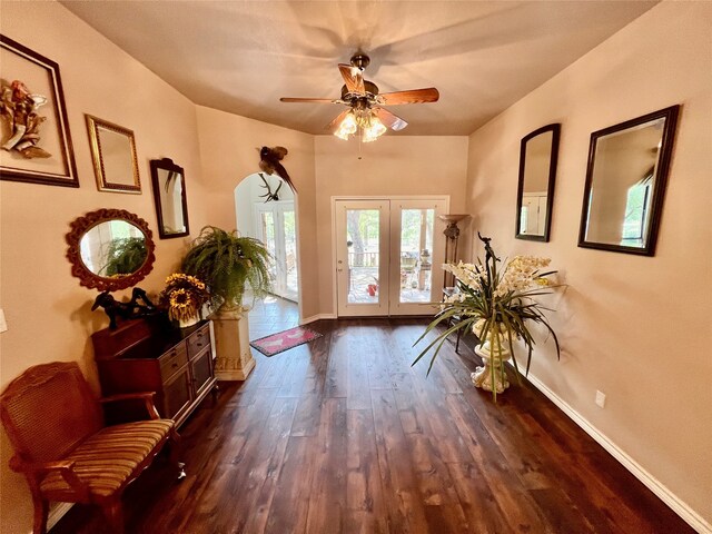 foyer entrance featuring french doors, dark hardwood / wood-style floors, and ceiling fan