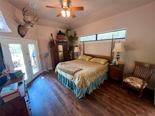 bedroom featuring multiple windows, dark hardwood / wood-style floors, access to outside, and ceiling fan