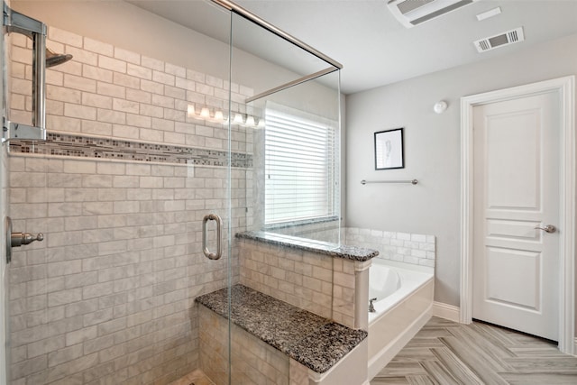 bathroom with plus walk in shower and parquet flooring