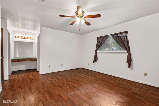 unfurnished bedroom featuring dark hardwood / wood-style floors and ceiling fan