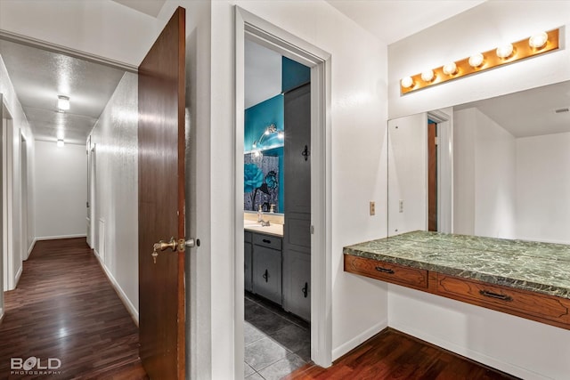 bathroom featuring hardwood / wood-style flooring and vanity