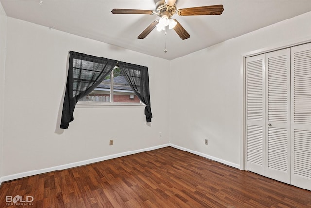 unfurnished bedroom with ceiling fan, hardwood / wood-style flooring, and a closet