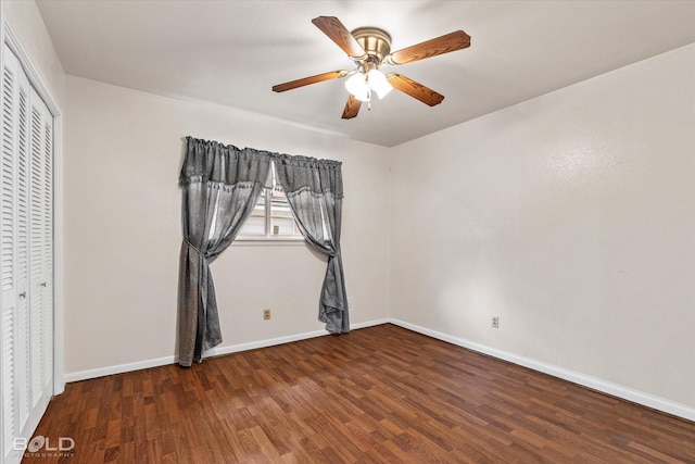 unfurnished bedroom featuring dark hardwood / wood-style floors, a closet, and ceiling fan