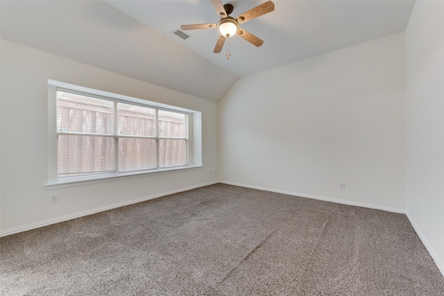 unfurnished room featuring carpet floors, ceiling fan, and vaulted ceiling