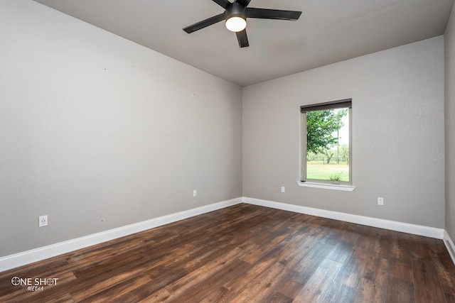 unfurnished room with dark hardwood / wood-style flooring and ceiling fan