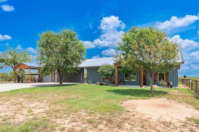 view of property hidden behind natural elements with a front yard